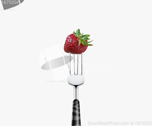 Image of strawberry  pierced by fork,  isolated on white background 