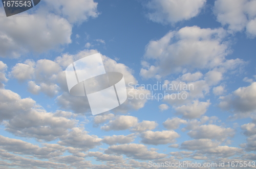 Image of cloudy blue spring sky sun-lit background 