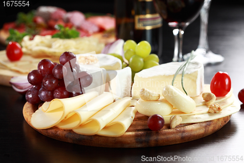 Image of Cheese and salami platter with herbs
