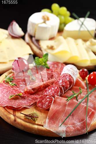 Image of Salami and cheese platter with herbs
