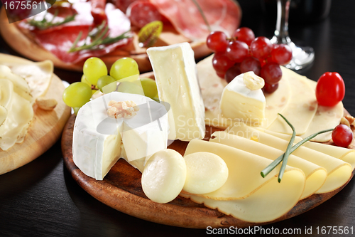 Image of Cheese and salami platter with herbs