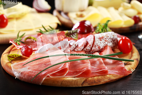 Image of Salami and cheese platter with herbs