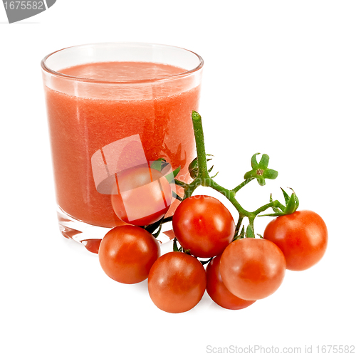 Image of Juice tomato in a glass and a bunch of tomatoes