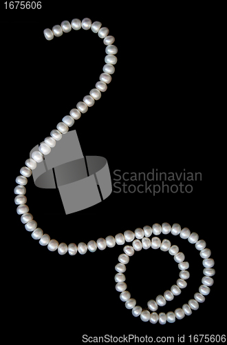 Image of White pearls on the black velvet 