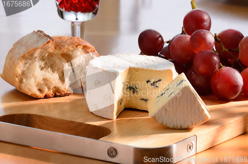 Image of Still-life with blue cheese, grape and bread.