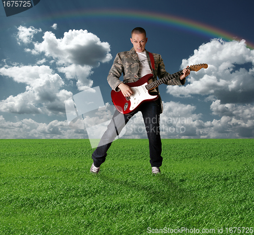 Image of hippie girl with the guitar outdoor