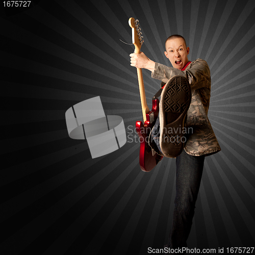 Image of rocker with guitar and foot