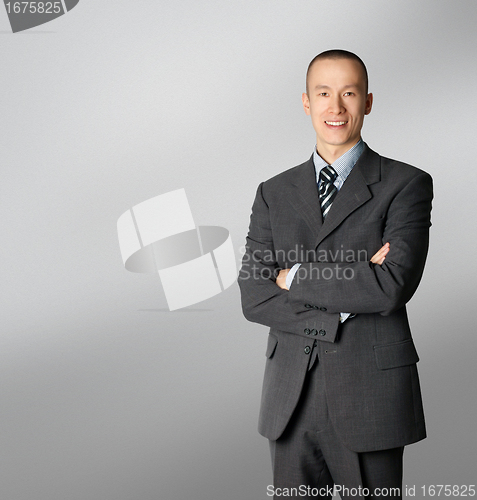 Image of smiling business man in suit