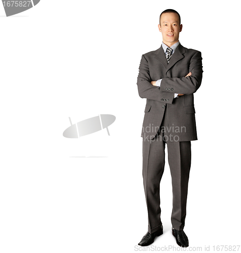Image of smiling standing businessman in suit 