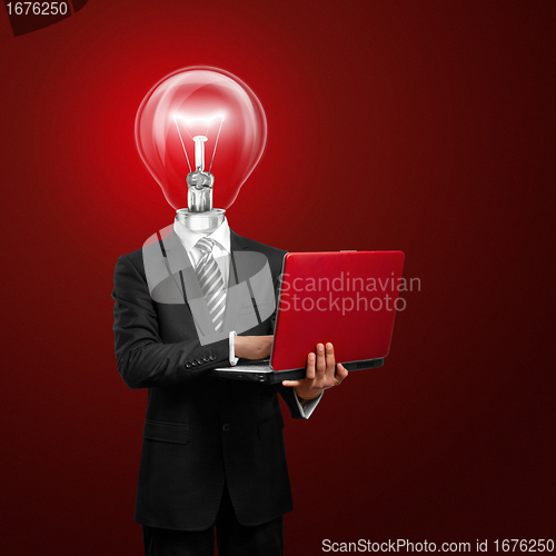 Image of lamp head businessman with laptop