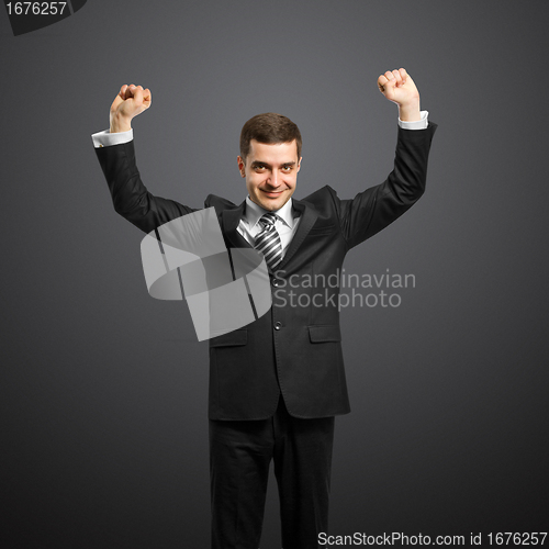 Image of businessman with hands up