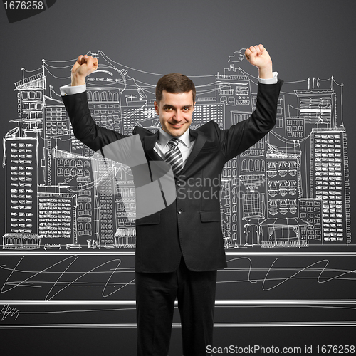 Image of businessman with hands up