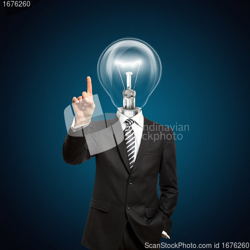 Image of businessman with lamp-head push the button