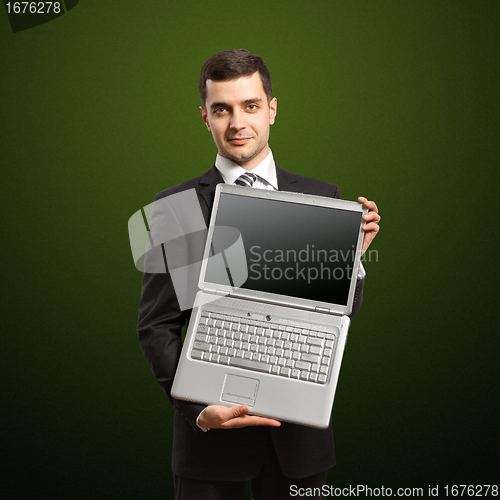 Image of businessman with open laptop in his hands