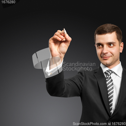 Image of businessman writing something
