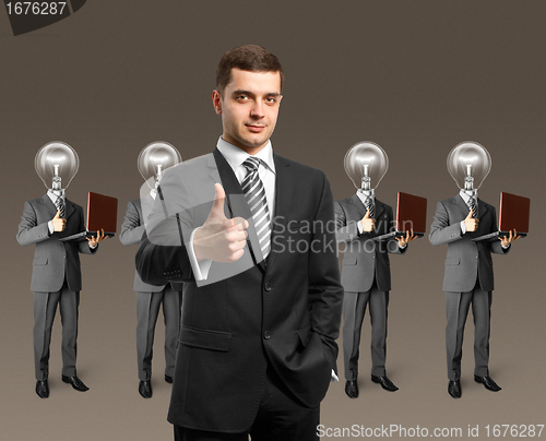 Image of lamp head business people with laptops