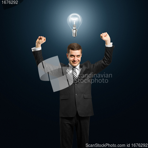 Image of lamp-head businessman with hands up