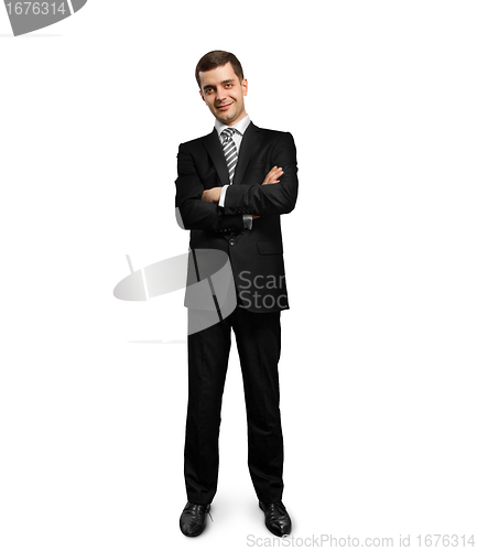 Image of full length male in suit with folded hands