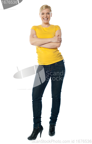 Image of Stylish teenager posing with crossed arms