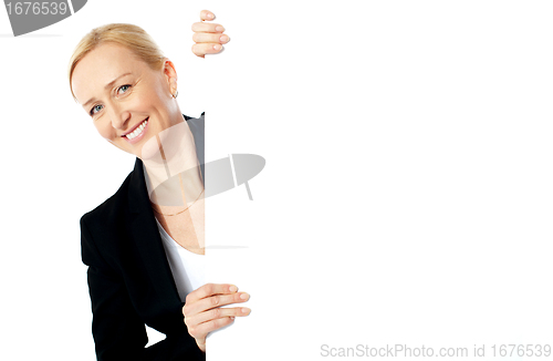 Image of Portrait of a businesswoman holding clipbaord
