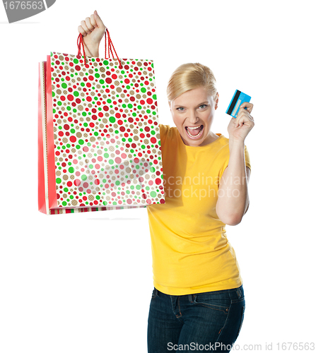 Image of Shopaholic teenager posing in excitement