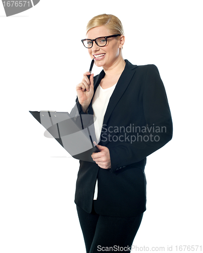 Image of Smiling mischievous female business executive