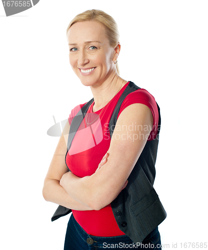 Image of Smiling aged lady with folded arms