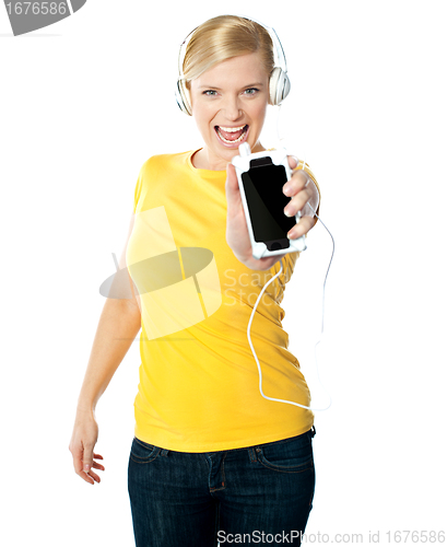 Image of Happy glamorous lady showing her iphone
