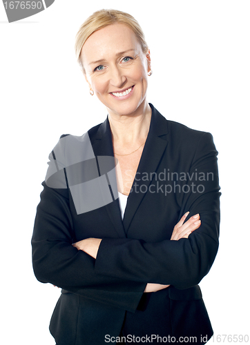 Image of Senior manager poisng with crossed-arms