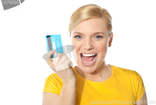Image of Blond sales girl posing with credit card
