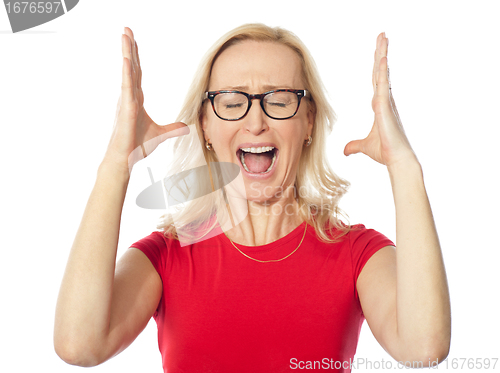 Image of Frustrated aged woman shouting