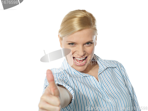 Image of Successful businesswoman showing thumbs-up