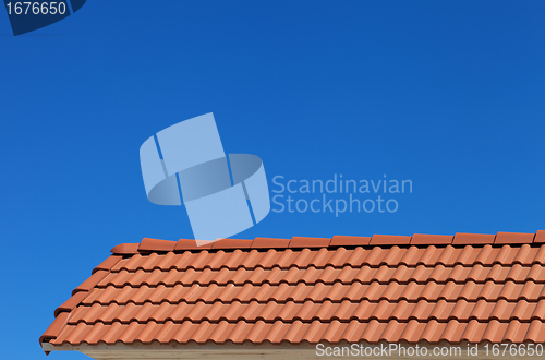 Image of Roof tiles and blue clear sky