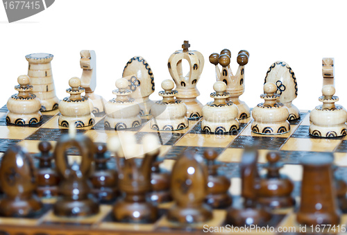 Image of chess board focus to white king and queen 