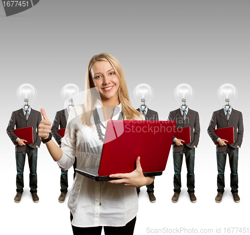 Image of woman and lamp head businesspeople with laptop