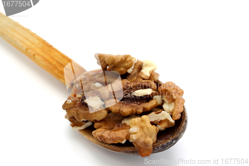 Image of wooden spoon with walnuts