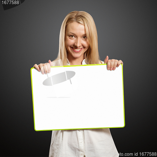 Image of happy businesswoman holding blank white card