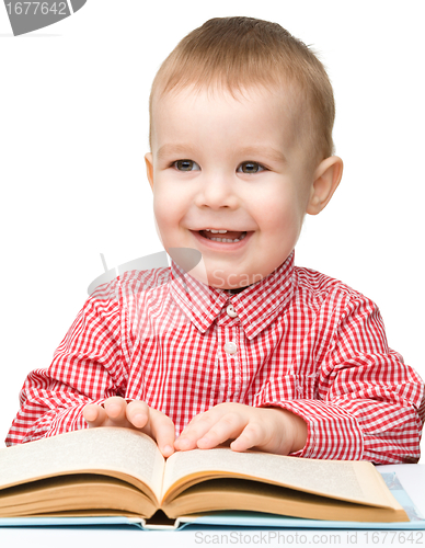 Image of Little child play with book