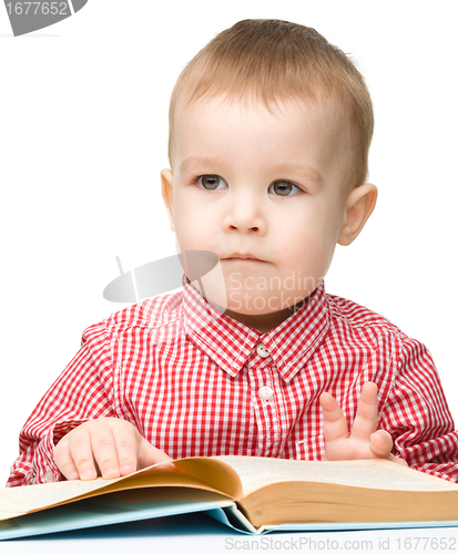 Image of Little child play with book