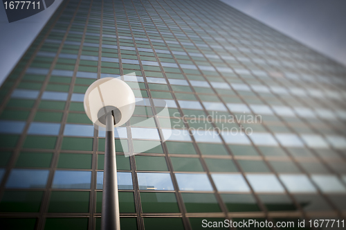 Image of Lamp post in front office building facade