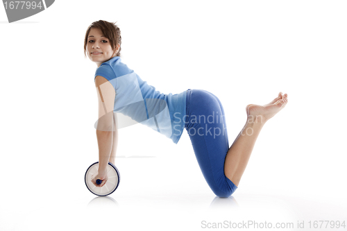 Image of Girl with a gymnastic roller