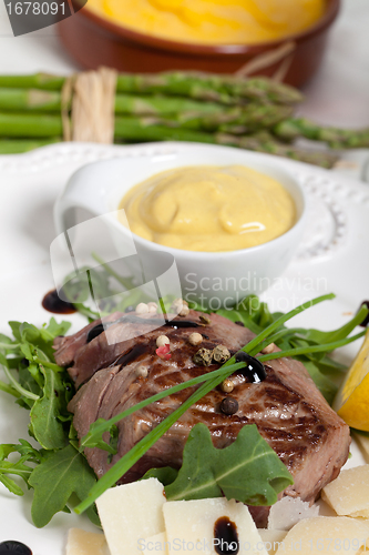 Image of Beef on arugula salad and parmesan