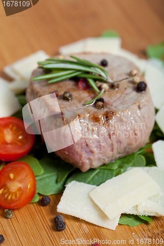 Image of Cooked Beef on arugula and parmesan