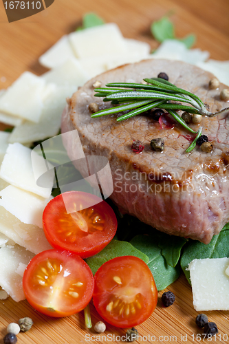 Image of Cooked Beef on arugula and parmesan
