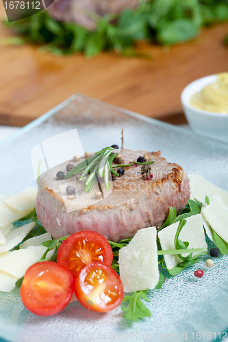 Image of Cooked Beef on arugula and parmesan