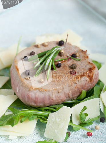 Image of Delicious Beef on arugula salad and parmesan