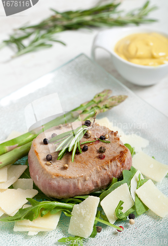 Image of Delicious Beef on arugula salad and parmesan