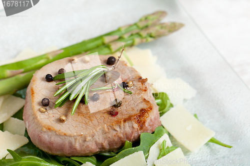 Image of Delicious Beef on arugula salad and parmesan