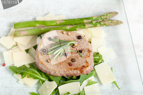 Image of Delicious Beef on arugula salad and parmesan