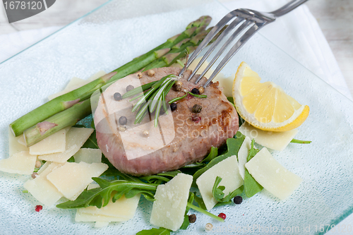 Image of Delicious Beef on arugula salad and parmesan